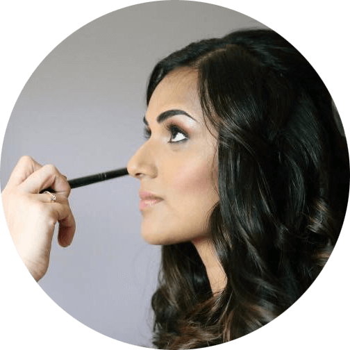 Fenella St John applying make-up to bride Brenda.